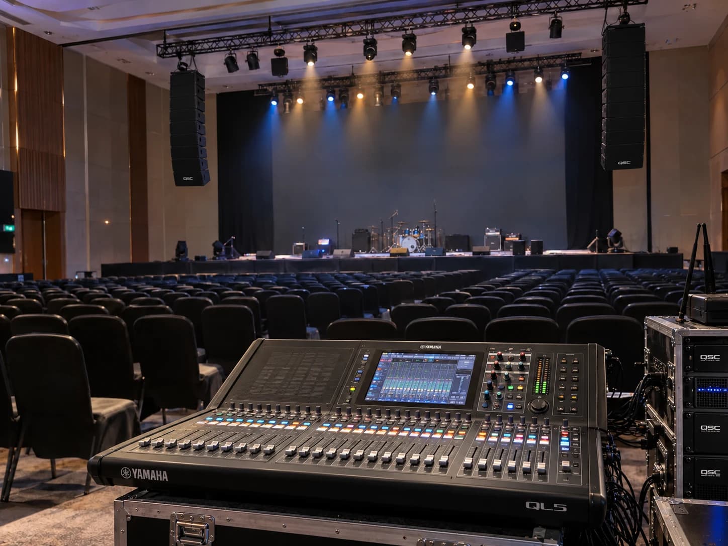 Auditorium audio mixing console, loudspeakers and stage lighting