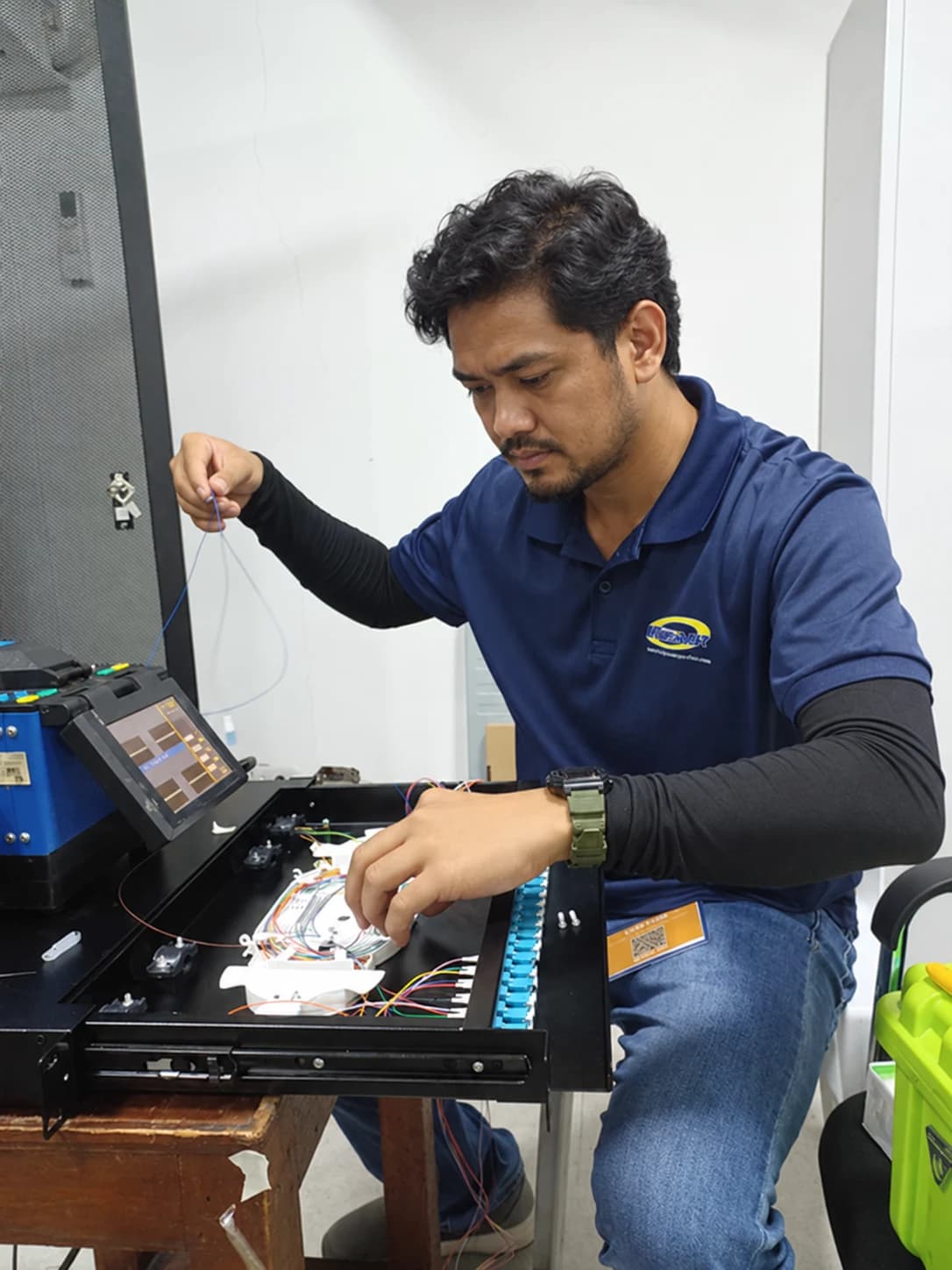 A technician working on fiber infrastructure
