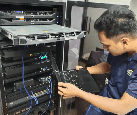 Hypernet technician configuring equipment in a server rack