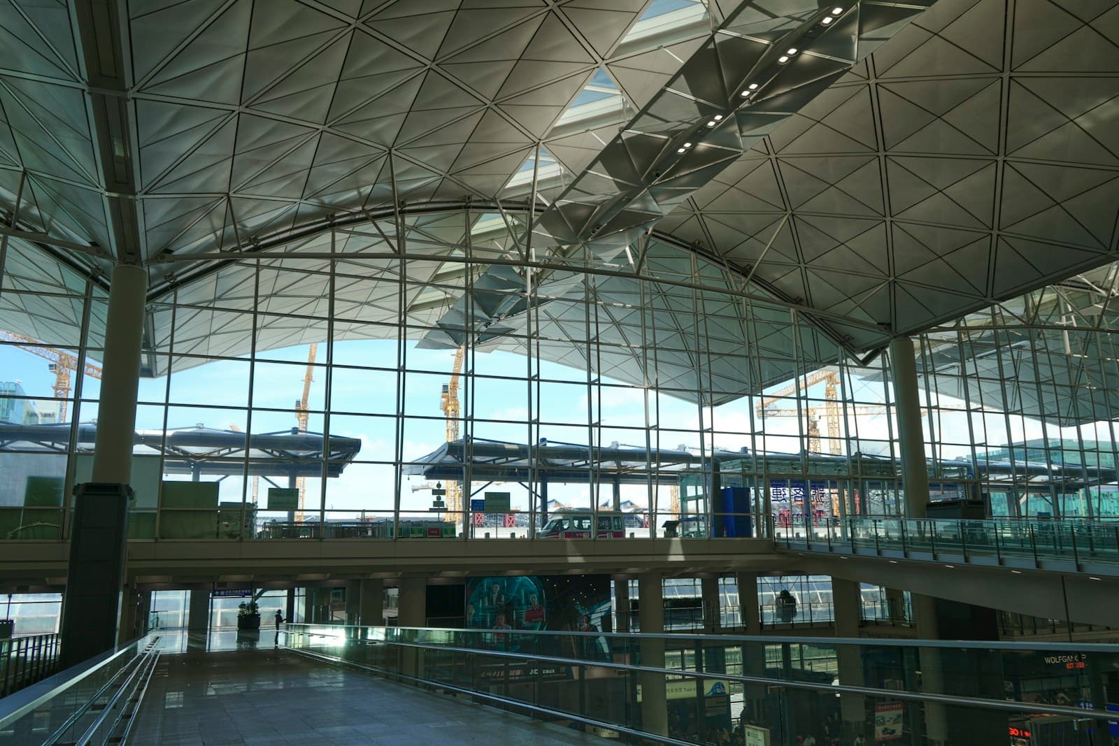 Glass walls and passenger circulation areas at Hong Kong International Airport